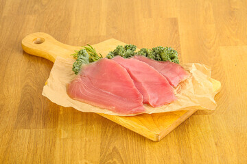 Raw salted tuna slice over board