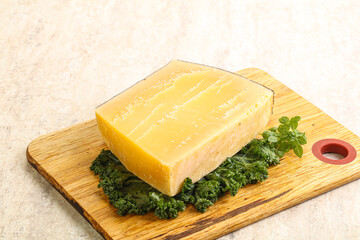 Parmesan cheese piece over board