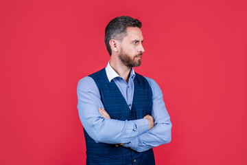 mature ambitious man businessman in businesslike suit has grizzled hair looking aside, confidence