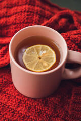 A cup of hot tea with lemon. Warming autumn drink. Autumn