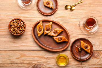 Composition with tasty baklava on wooden background