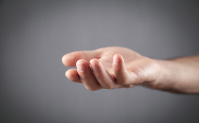 Caucasian man showing empty hand.