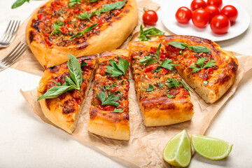 Tasty sliced Turkish Pizza on white background