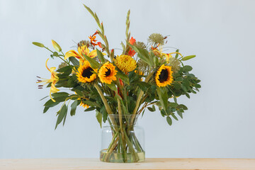 Autumn bouquet with sunflowers, gladioli, chrysanthemum, gladiolus, lily, montbretia, eucalyptus...