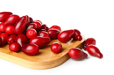 Board with ripe dogwood berries on white background