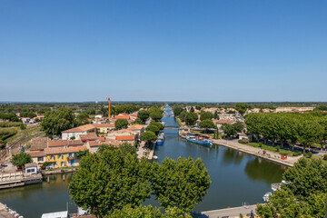 Fototapeta na wymiar Canal du Rhône à Sète, chanel traversing Aigues-Mortes, Occitanie region of southern France, Europe
