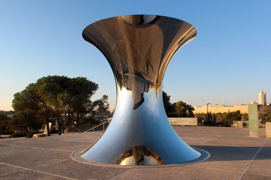Jerusalem, Israel - December 2, 2013: "Turning the World Upside Down", 2010 polished steel hourglass sculpture by world famous British-Indian artist Anish Kapoor.