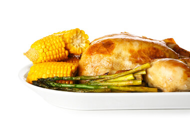 Tasty baked turkey with vegetables for Thanksgiving Day on white background, closeup