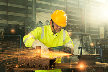 Asian workers in safety uniforms polishing castings in industrial companies,