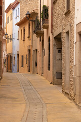 deserted street in the medieval town of begur on the costa brava on a cloudy summer day