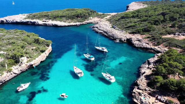 Aerial view, flight at Cala Sa Nau, near Cala d'Or, with beaches and sailing boats, Migjorn region, Mallorca, Balearic Islands, Spain