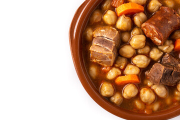 Traditional Spanish cocido madrileño in bowl isolated on white background