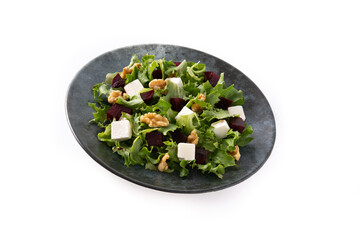 Beetroot salad with feta cheese,lettuce and walnuts isolated on white background
