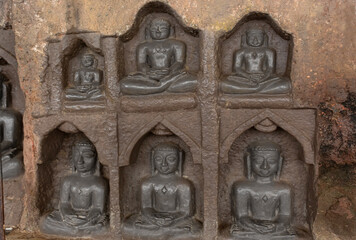 Carved idols of Digambar Jain Tirthankaras on the rock of Mangi Tungi, Nashik, Maharashtra, India.
