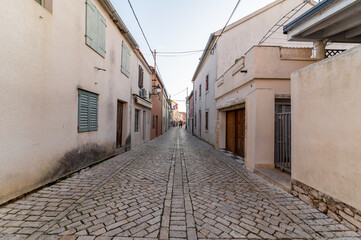 Old buildings in the narrow streets of the historical town in Nin, Croatia. Famous Dalmatia travel city on the Adratic coast.