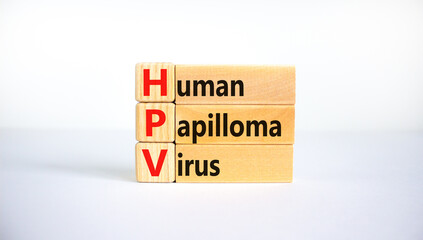 HPV, Human papilloma virus symbol. Concept words HPV, Human papilloma virus on wooden blocks on a...