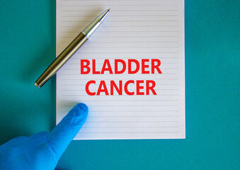 Bladder cancer symbol. White note with words Bladder cancer, beautiful blue background, doctor hand...