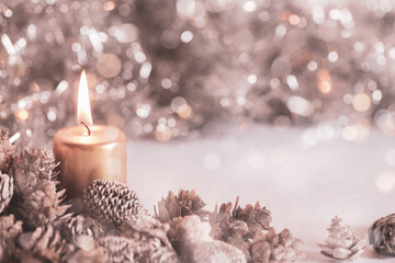 Christmas still card or background.  Copy space with lit candle