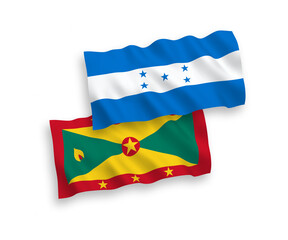 National vector fabric wave flags of Grenada and Honduras isolated on white background. 1 to 2 proportion.