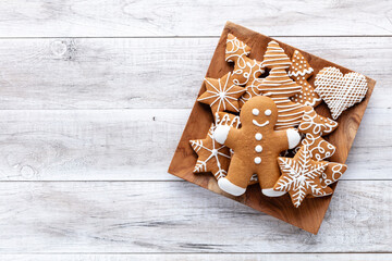 Homemade christmas gingerbread cookies on wooden table.