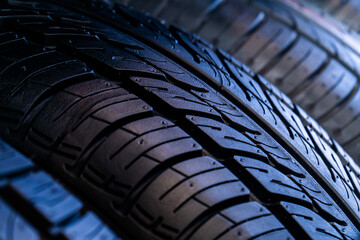 photographs of car tires, detailed and general plan. tires are folded in rows or on each side