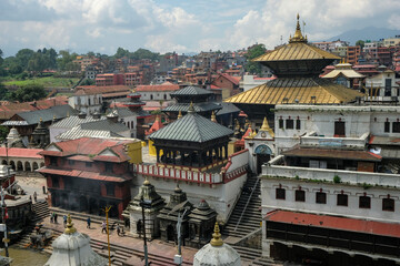 Kathmandu, Nepal - September 2021: People making offerings on the ghats of the Pashupatinath Temple...