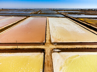 Amazing colors of sea salt ponds called salines shortly before salt harvest in Portugal