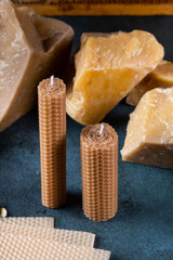 A handmade candle made of natural wax with texture of honeycomb bees. beeswax for craft candles. Organic candle
