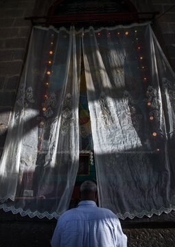 Ethiopian pilgrim praying at Entoto orthodox Maryam Church, Addis Ababa Region, Addis Ababa, Ethiopia