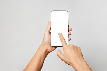 Woman hand holding phone on white background with copy space