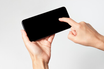 Woman holding smartphone with black screen