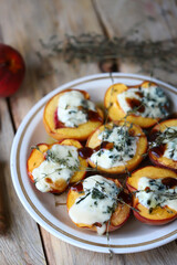 Baked peaches with dor blue cheese. Healthy food. The keto diet. Vegetarian snack.