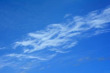 Cirrus clouds and a pattern of them, at a high altitude in the sky.