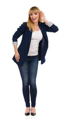 Young Woman In Blue Unbuttoned Suit Is Holding Hand On Ear, Eavesdroping And Smiling