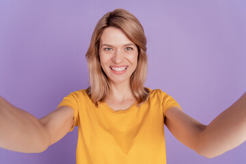 Close up photo beautiful woman happy positive smile make take selfies isolated over purple color...