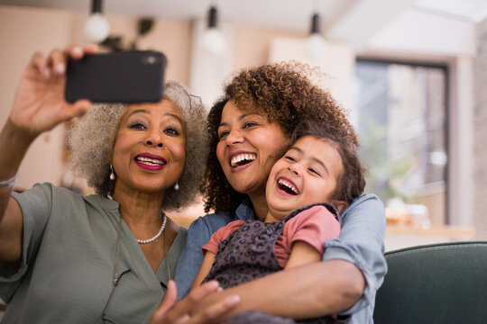 Three generations of family taking a selfie