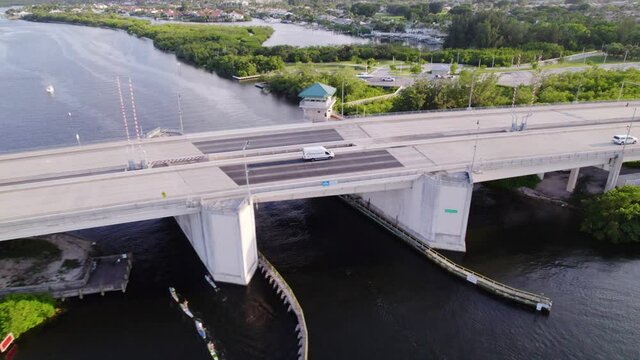 Aerial drone view of a van on a bridge, freeway 706, in bright, sunny, Jupiter, Florida