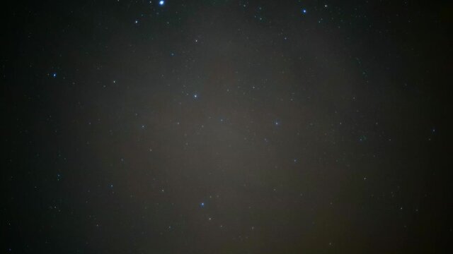 4K astro timelapse of stars on a clear night sky, slowly dissapearing because of clouds coming in.