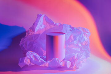 Cylinder podium with crumpled paper in neon light. Stylish geometric shapes to show  products....