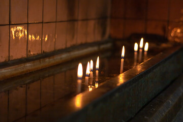 Christmas candles in the catholic church. Burned christmas candles.