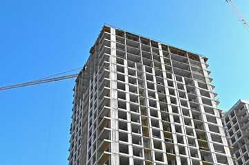 Crane and highrise construction site