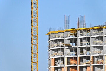 Crane and highrise construction site