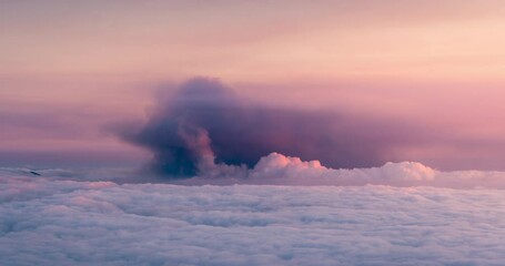 sunset day to night time lapse of Volcanic ash cloud and sea of clouds in La Palma Island during volcano cumbre vieja eruption in September 2021