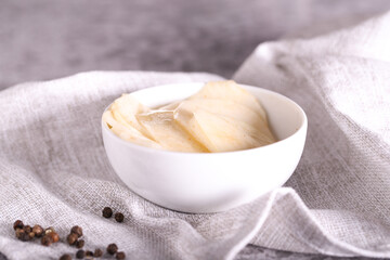 white radish slices with red pepper and oil
