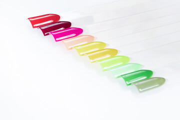 Multiсolor nail tips on a white background. examples of manicure for nails. Palette with color...