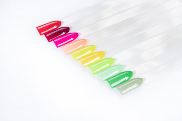 Multiсolor nail tips on a white background. examples of manicure for nails. Palette with color samples of nail. Copy space