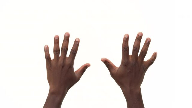 Close up of two black man's hands showing enough gesture. Number 10. Isolated on a white background
