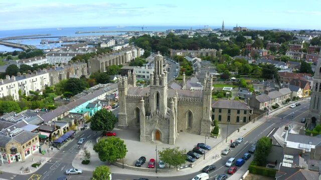 Monkstown Parish Church, Dublin, Ireland, September 2021. Drone gradually orbits the church in the center of the village with views east to D&uacute;n Laoghaire in the background.