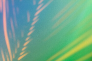 Abstract background with shadow from a palm leaf in neon light.