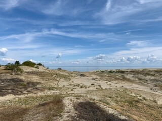 Beautiful dunes with seascape background, perfect surface of the sea